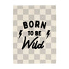 Checkered blanket with 'Born to be Wild' text and lightning bolts on a white background
