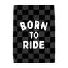 Checkered blanket with 'Born to Ride' text on a white background