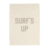 Beige towel with 'SURF'S UP' text on a white background